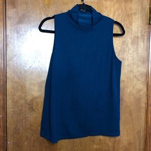 Gently worn sleeveless blouse. Size M.